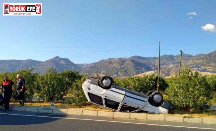 Takla atarak ters dönen otomobilden burunları kanamadan çıktılar